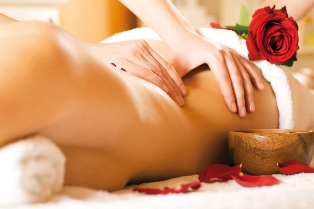 massage hands on a body representing somatic healing symbolic of sexual healing and sensual embodiment 